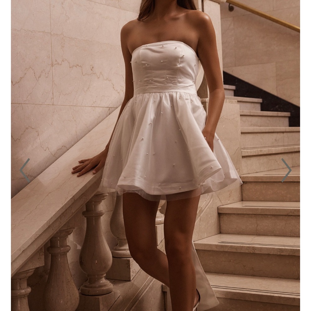 SHOWPO CAILENE MINI DRESS - STRAPLESS BOW TRAIN FIT AND FLARE DRESS IN IVORY